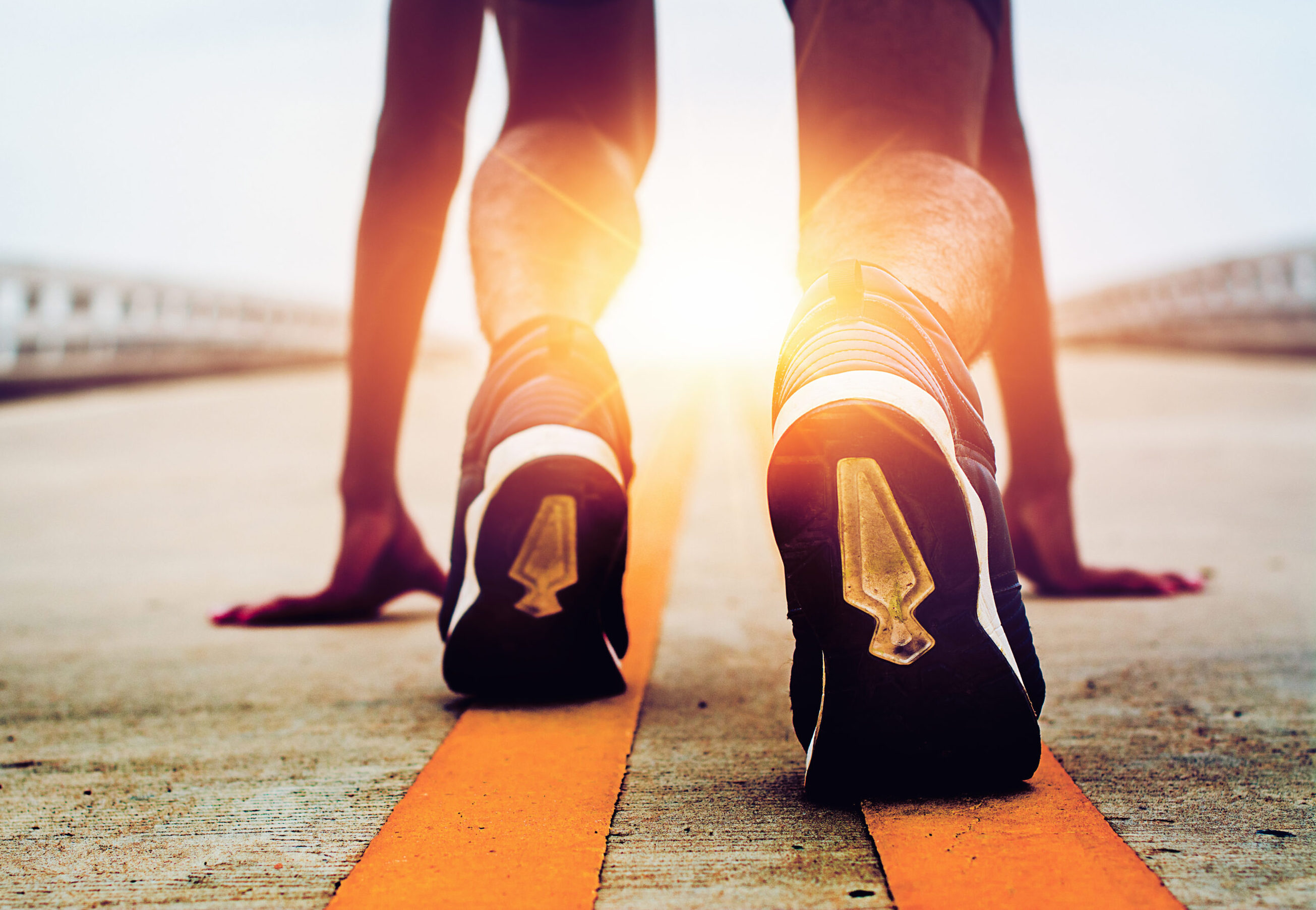 athletes are starting on the road with morning sunshine e1775685811761